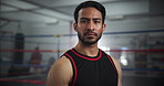 Serious, sports and face of man boxer in gym for competition practice, match or workout for conditioning. Pride, confident and portrait of fighting champion from Mexico in ring for fitness training.