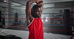 Black man, stretching and ready for boxing at gym for wrestling match, fitness combat and competition routine. Male boxer, warm up and start fight for battle performance, mma sport and challenge goal