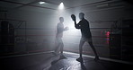 Boxer, instructor and men with training for fitness in boxing ring with punch workout, agile fighting skills or intense action. Impact sport, fighter preparation or coach with gloves for self defense