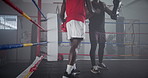 Boxing ring, training and men in gym with handshake for challenge, competition and coaching for fight. Sports team, boxer and personal trainer with exercise, fitness and shaking hands at mma club