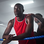 Boxing, rest and man in gym with fatigue, breathing and fitness ...