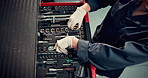 Above mechanic, engineer and toolbox with person in garage, service center and transport industry. Workshop, auto repair and repairman hands with ratchet spanner for maintenance, safety or motor care