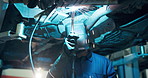 Mechanic, repairman and car with welding in service center, garage and transport industry. Workshop, auto repair and engineer working on vehicle for industrial maintenance, safety and motor care