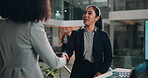 Conference, handshake and introduction with business women in office together for tradeshow event. Computer, lobby and smile with happy employee people shaking hands for welcome to corporate seminar