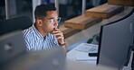 Computer, research and thinking with business man reading information at desk in office for planning. Creative, design and idea with employee person in workplace at night for overtime deadline