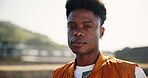 Serious, gen z and student with face of black man in city for youth, culture and Identity. Summer, fashion and cool with portrait of person in urban Kenya downtown for vacation, trends and style
