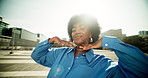 Happy, black girl and city with fashion for style, afro or clothing in an urban town. Portrait, young African or female person with smile in joy for stylish outfit, jewelry or expression in street