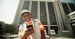 Happy, black man and typing with phone outdoor for reading funny meme, social media and communication. Smile, person and scroll with mobile of online blog, streaming video and texting contact in city