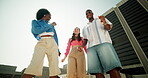 Dancing, friends and fun on roof, fashion and energy of Gen z, diversity and bonding with rhythm or group. Dancer, celebration and people with trendy clothes, outdoor or together for party or weekend