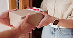 Hands, box and delivery to customer at front door for ecommerce, shipping and logistics. Courier, woman and giving parcel or package for order, shopping and fast distribution service at home closeup