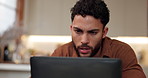 Laptop, thinking and man in home reading email for feedback, review or update on freelance job. Computer, research and male copywriter with blog post on media, online or internet for remote work.