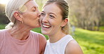 Fitness, kiss or park with mother and daughter outdoor in summer for cardio or marathon training. Exercise, laughing or smile with mature parent and woman laughing in forest for start of routine