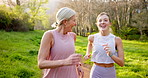 Exercise, park or running with mother and daughter outdoor in summer for cardio or marathon training. Fitness, sports or workout with mature parent and woman in forest for bonding or wellness