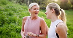 Fitness, laughing or walking with mother and daughter outdoor in summer for cardio or marathon training. Conversation, drinking water or exercise with mature parent and woman in forest for workout