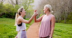 Outdoor, mother and daughter with high five, fitness and victory with challenge, training and workout. Motivation, family and parent with girl, mama and exercise with gesture, happiness and wellness