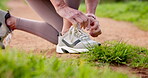 Hands, outdoor and woman with shoelace for fitness, running and walking for health. Female person, closeup and preparing in training shoes with jogging, exercise and workout for wellness or self care