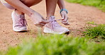 Hands, outside and woman with shoelace for fitness, running and walking for health. Female person, closeup and preparing in training shoes with jogging, exercise and workout for wellness or self care