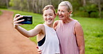 Mature mom, daughter and fitness on selfie with happiness for social media, post and profile picture in `Canada. People, family and smile in park or forest on morning walk, run and exercise breast