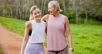 Mature mother, daughter and hug for fitness with morning walk, run and exercise in Germany. People, family and smile or happy on conversation in park with bonding, support and  jogging for health