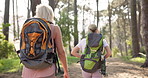 Mom, daughter and backpack for hiking with back in forest with fitness adventure, bonding and sightseeing in nature. Mature woman, girl and trekking in woods for cardio exercise, explore and walking