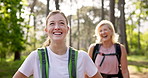 Mom, daughter and hiking with laughing in forest for fitness adventure, talking and funny joke with bonding. Mature woman, girl and happy with trekking in woods for cardio exercise and explore nature