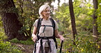 Hiking, thinking and mature woman in nature, woods and sightseeing of environment, outdoor and adventure. Backpacking, forest and person with trekking poles, landscape or equipment for balance in USA