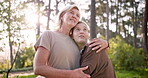 Bonding, mom and child in woods, hug and mature woman with daughter, nature and sightseeing in morning. Embrace, mother and girl in forest, trees and talking with kid, smile and happy in Canada