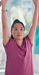 Senior woman, exercise and yoga in class at gym healthy body, balance and fitness in retirement. Female person, yogi and stretching at health club for wellness, support and workout in morning