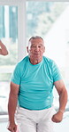 Gym, senior man and fitness with jump for wellness, coordination and balance with endurance. Class, group and male mentor with punch exercise for cardiovascular health, aerobics and physical training