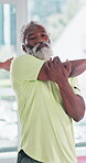 Senior man, stretching and exercise in gym for retirement, fitness and preparing for workout. Black person, serious and arm with flexibility at health club for warm up,  wellness or start of training