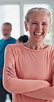 Fitness, class and portrait of mature woman with smile, confidence and workout at gym. Yoga, relax and happy face of senior person at health club for exercise, wellness or self care with arms crossed