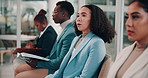 Frustrated woman, waiting room or workshop with employees for business opportunity, deadline or seminar. Young, female person or group in conference, row or line with delay on presentation or meeting