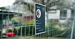 Animal shelter, cage and sign of rescue dog outdoor for adoption, community or pet ownership. Charity, fence and poster with information on enclosure at pound for activism, attention or welfare