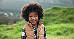 Kid, face and happy in nature for travel, journey and excited for holiday in Brazil. Young boy, laugh and portrait in countryside for adventure, fun activity and weekend trip in field environment