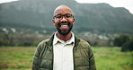 Black man, happy and glasses in nature for travel, journey and excited for vacation in Brazil. Person, spectacles and portrait in countryside with laugh, adventure and fresh air for wellness on field