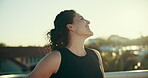 Happy, woman and relax for fitness outdoor with exercise break, blue sky and workout wellness in city. Thinking, female person and pride from training, morning rest and breathing with view on bridge