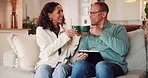 Home, coffee toast or couple on tablet for choice, news or online website on sofa in living room. Drinking beverage, cheers or people in house on social network app or digital website or touchscreen