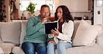 Conversation, tablet and thinking with mature couple on sofa in living room of home together for budget. Debt, finance or wealth with worried man and woman in apartment for investment or savings