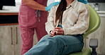 Anxiety, support and hands with woman at dentist for cleaning, oral hygiene and checkup. Consulting, dental and healthcare advice with closeup of person at clinic for orthodontist, nervous and trust