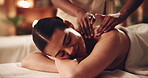 Woman, hands and back massage with smile at spa for muscle tension, luxury treatment or body pamper. Wellness, masseuse and apply shoulder pressure on client for pain relief, relax or healing therapy