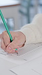 Hands, writing and student with multiple questions test in classroom at school for scholarship admission. Education, learning and closeup of person studying with practice exam, assignment or project.