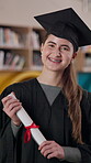 Graduation, student and degree with achievement, success and high school for university or college. Female person, happiness and milestone for celebration, diploma or education for career at ceremony