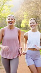 Mature mom, daughter and laughing for fitness outdoor with running, walking and bonding. People, parent and smile on vertical in forest for fun, support and trust with love for health and wellness