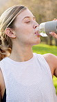 Woman, drinking water and hydration in walking, running or fitness for wellness exercise as athlete. Female person, health and outdoor sport with, detox, rest and break in activity, workout or nature