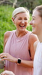 Mature woman, daughter and laughing on walk for fitness, wellness and exercise in nature or outdoor. Female people, conversation and activity together for fresh air, bonding and connection as family