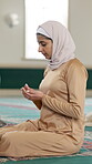 Islamic, woman and praying in mosque with faith for healing, trust and peace in praise on carpet. Muslim, person and calm in religious building with worship for spiritual, dua and prayer to Allah