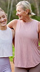 Mature mom, daughter and happy for fitness outdoor with running, walking and bonding. People, parent and smile on vertical in forest for bonding, support and trust with love for health and wellness