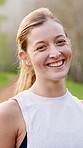 Happy, fitness and face of woman in nature for running, workout and training for marathon. Smile, sports and portrait of female athlete from London outdoor in park with cardio exercise for endurance.