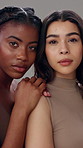 Beauty, face and serious with woman friends in studio together for natural cosmetics or dermatology. Love, portrait and skincare with confident model people hugging for aesthetic, bonding or unity