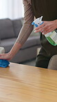 Hands, cleaning service and dust for housekeeping, hygiene and disinfectant in home as worker. Person, employee and cloth with spray cleaner with germs, bacteria and product on table surface in house